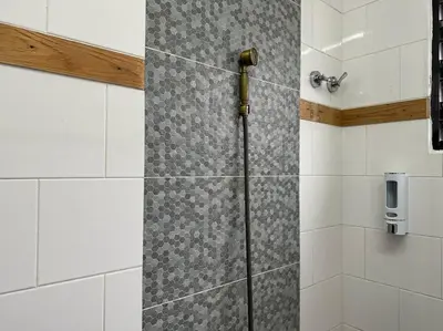 a shower with a glass door in a bathroom at Ipoh Family Homestay Masjid Muhammadiah Evicharger SY16 in Ipoh