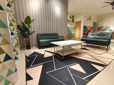 a living room with couches and a table at Pavilionvillie M1T583 by irainbow in Kampong Kepayang