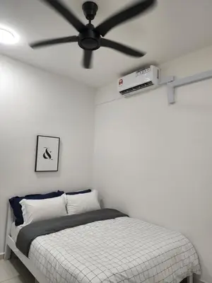 a bedroom with a ceiling fan and a bed at NORDIC SKYHOME Ipoh in Kampong Ulu Chepor