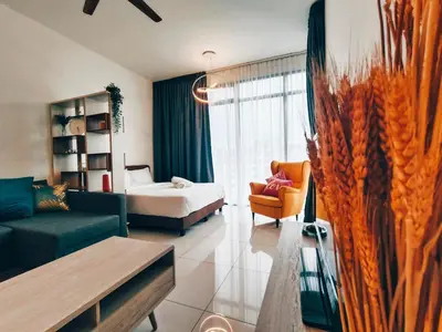 a living room with a couch and a bed at Beacon Executive Suites 2BR at Georgetown by WL in George Town