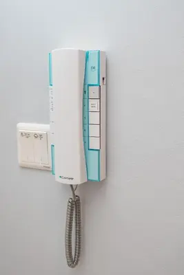 a phone is hanging on a wall at Ipoh Tambun Lost World Sunway Onsen Suites Luna 2R2B 8paxs in Ipoh