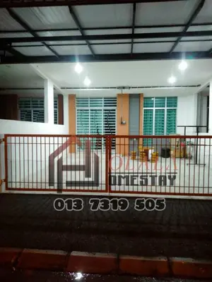 a house with a fence in front of it at Olala Homestay Tanjung Rambutan Perak in Tanjung Rambutan