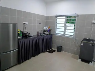 a kitchen with a refrigerator and a window at Olala Homestay Tanjung Rambutan Perak in Tanjung Rambutan