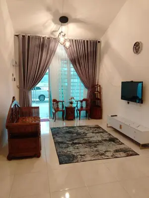 a large living room with a television and a couch at Olala Homestay Tanjung Rambutan Perak in Tanjung Rambutan