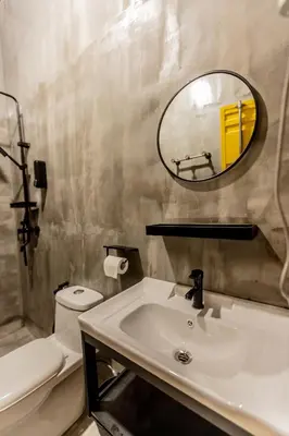 a bathroom with a sink and a mirror and a toilet at PADI Sentral @ Sekinchan in Sekincan