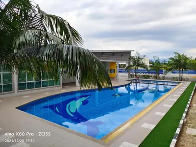a swimming pool in front of a building at Pavilionvillie M1T584 by irainbow in Simpang Pulai