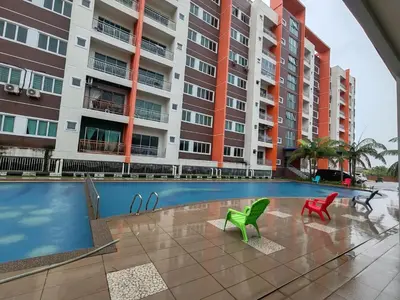 a swimming pool in front of a apartment building at Pavilionvillie M1T584 by irainbow in Simpang Pulai