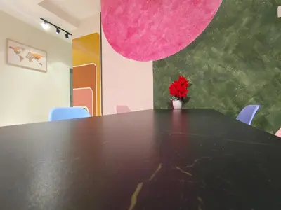 a black table with a red flower in a vase at Pavilionvillie M1T570 by irainbow in Ipoh
