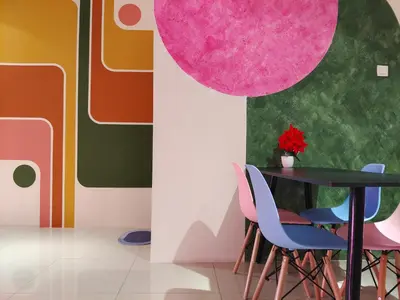 a dining room with a black table and pink chairs at Pavilionvillie M1T570 by irainbow in Ipoh