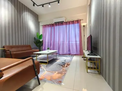 a living room with a couch and a tv at Pavilionvillie M1T571 by irainbow in Ipoh
