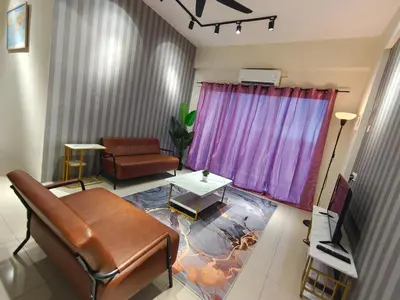 a living room with a couch and a table at Pavilionvillie M1T571 by irainbow in Ipoh