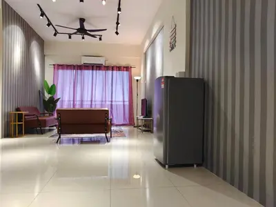 a living room with a black refrigerator in a room at Pavilionvillie M1T571 by irainbow in Ipoh