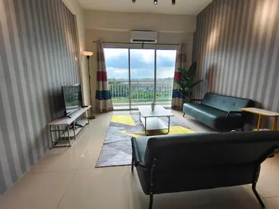 a living room with a couch and a large window at Pavilionvillie M1T572 by irainbow in Ipoh