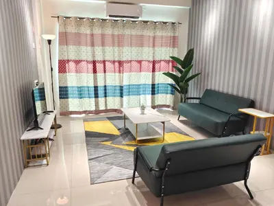 a living room with a couch and a table at Pavilionvillie M1T572 by irainbow in Ipoh