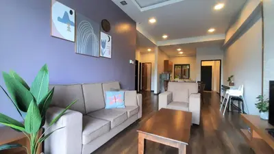 a living room with a couch and a table at G Residence - 3R2B The Retreat, Aranda Nova, Cameron Highlands in Cameron Highlands