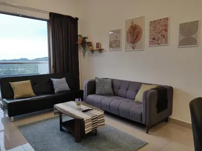 a living room with a couch and a coffee table at Mars Homestay in Kea Farm Brinchang in Brinchang