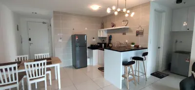 a kitchen with a refrigerator and a table and chairs at H&W Sunway Onsen Suite 4-7pax near Lost World of Tambun Ipoh in Ipoh