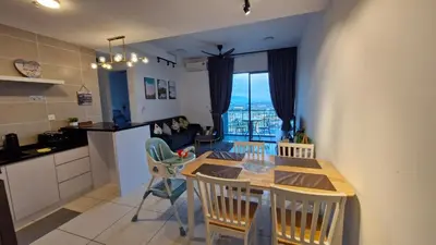 a kitchen and dining room with a table and chairs at H&W Sunway Onsen Suite 4-7pax near Lost World of Tambun Ipoh in Ipoh