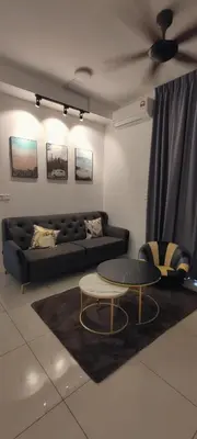 a living room with a couch and a table at H&W Sunway Onsen Suite 4-7pax near Lost World of Tambun Ipoh in Ipoh