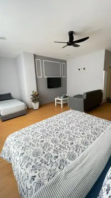 a bedroom with a bed and a flat screen tv at Only You Boutique Hotel Centrum Cameron Highlands in Brinchang