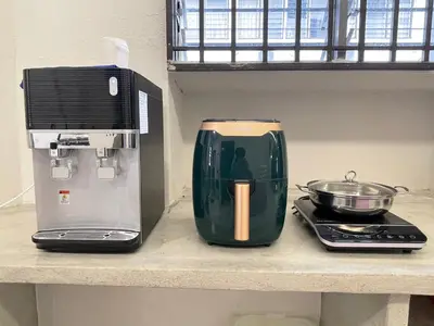 a kitchen counter with a coffee maker and a toaster at GEORGETOWN 18Px 5R4B V KTV & JACCUZI SPA & POOL TABLE NEAR USM & LAM WAH EE HOSPITAL & HAN CHIANG HIGH SCHOOL - kids pool no more in Gelugor