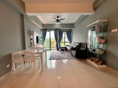 a living room with a couch and a table at BLUE JADE STUDIOS in Tanah Rata