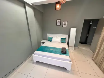 a bedroom with a bed in a room at BLUE JADE STUDIOS in Tanah Rata