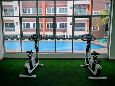 two exercise bikes in a room with a large window at Pavilionvillie M1T6100 by irainbow in Ipoh