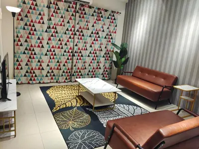 a waiting room with a couch and a table at Pavilionvillie M1T6100 by irainbow in Ipoh