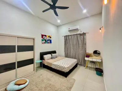 a bedroom with a bed and a ceiling fan at Comfort 36 Entire House At Alma Bukit Mertajam in Bukit Mertajam