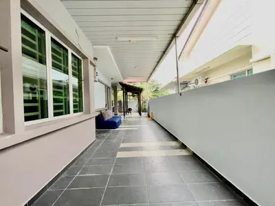 an empty hallway of a building with a tile floor at Comfort 36 Entire House At Alma Bukit Mertajam in Bukit Mertajam