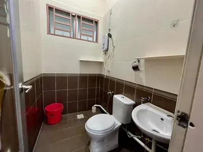 a small bathroom with a toilet and a sink at Comfort 36 Entire House At Alma Bukit Mertajam in Bukit Mertajam