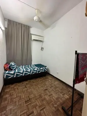 a small room with a bed and a window at Bayu Emas Ferringhi Homestay in Batu Ferringhi