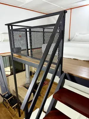 a ladder leading up to a bunk bed in a room at Ardour Lodge 