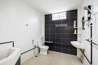 a bathroom with a toilet and a sink at Seaside Private Bungalow, Tg Bungah in Tanjung Bungah