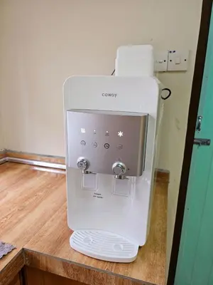 a white coffee maker sitting on top of a counter at Air-home No 9 Kampung Boyan, 4BR, 9pax, Netflix in Taiping