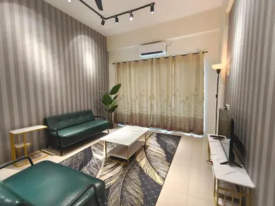 a living room with a couch and a table at Pavilionvillie M1T11 by irainbow in Simpang Pulai