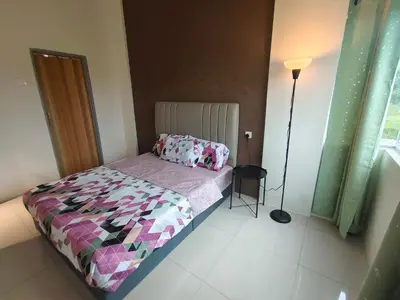 a small bedroom with a bed and a lamp at Pavilionvillie M1T11 by irainbow in Simpang Pulai