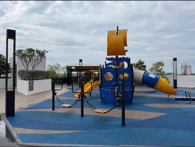a playground with a slide on a blue carpet at Cozy Suite Studio Meritus Residensi Perai in Perai