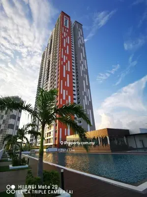 a tall red building with a palm tree in front of it at Cozy Suite Studio Meritus Residensi Perai in Perai