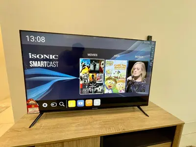 a flat screen tv sitting on top of a wooden table at Cozy Suite Studio Meritus Residensi Perai in Perai