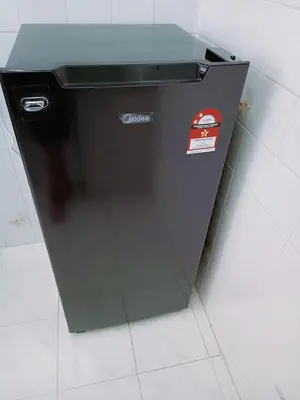 a black refrigerator with a sticker on the side of it at Jo-Rumah 3 Bedroom Apartment Jelutong Georgetown Penang Free WIFI in Jelutong
