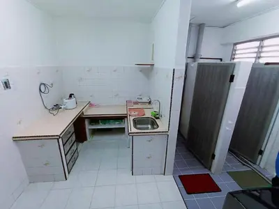 a small kitchen with a sink and a counter at Jo-Rumah 3 Bedroom Apartment Jelutong Georgetown Penang Free WIFI in Jelutong