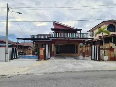 a building with a balcony on the side of a street at HOMESTAY EPOH MANJOI WITH PRIVATE POOL AND JACUZZI in Ipoh