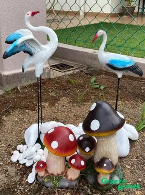 a group of fake mushrooms and birds on the ground at Ipoh Town Bangalow Canning Garden Football Table in Ipoh