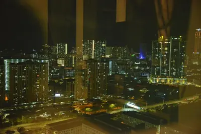 a view of a city at night at MARITIME SUITES DUPLEX MARVELOUS SEA VIEW in George Town