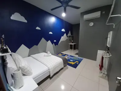 a bedroom with a bed with a cloud wall at RS Homestay in Sungai Petani