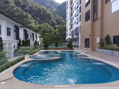 a swimming pool in the middle of a building at Onsen Suite at Sunway Lost World Tambun in Ipoh