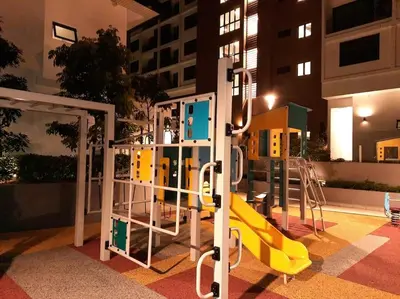 a playground with a yellow slide in a building at Onsen Suite at Sunway Lost World Tambun in Ipoh