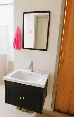 a bathroom with a sink and a mirror on the wall at Destiny Homestay in Sungai Petani